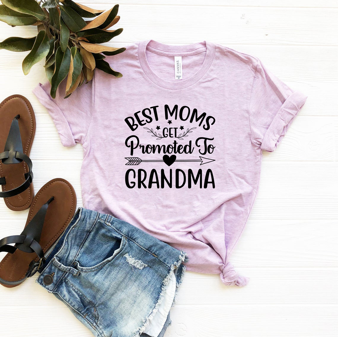 Unisex T-shirt featuring the phrase 'Best Moms Get Promoted To Grandma' in a stylish design, available in multiple colors.
