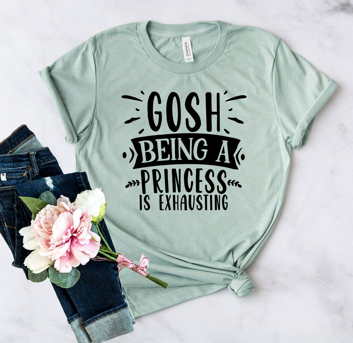 DT0639 unisex T-shirt featuring 'Gosh Being a Princess is Exhausting' design, made from soft ring spun cotton, available in multiple colors.