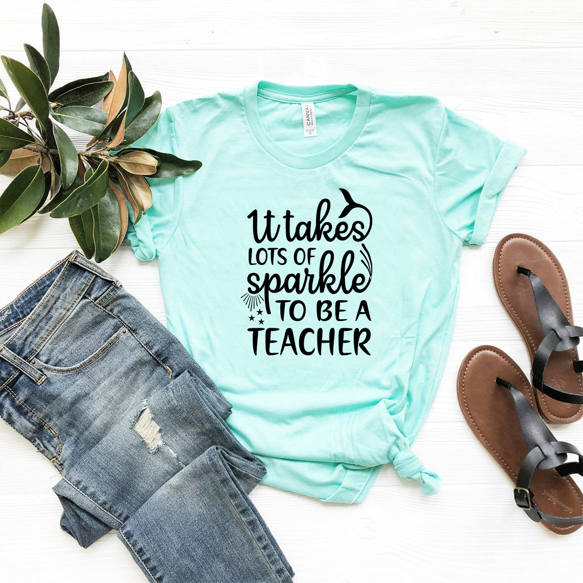 Unisex T-shirt with the phrase 'It Takes Lots of Sparkle to be a Teacher' printed in vibrant colors, showcasing a comfortable fit.
