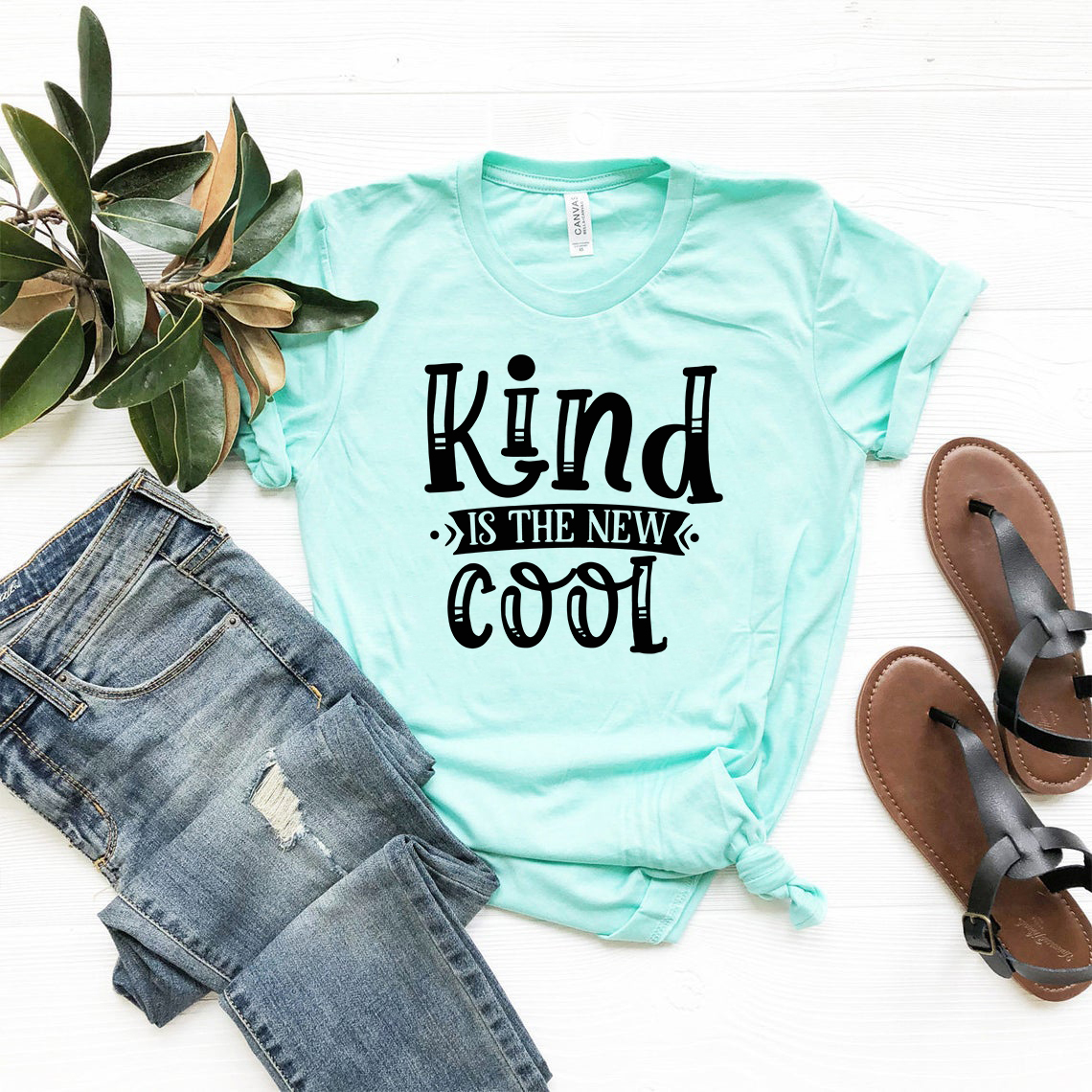 DT0683 Kind is the New Cool unisex T-shirt in various colors, showcasing its soft fabric and modern design.