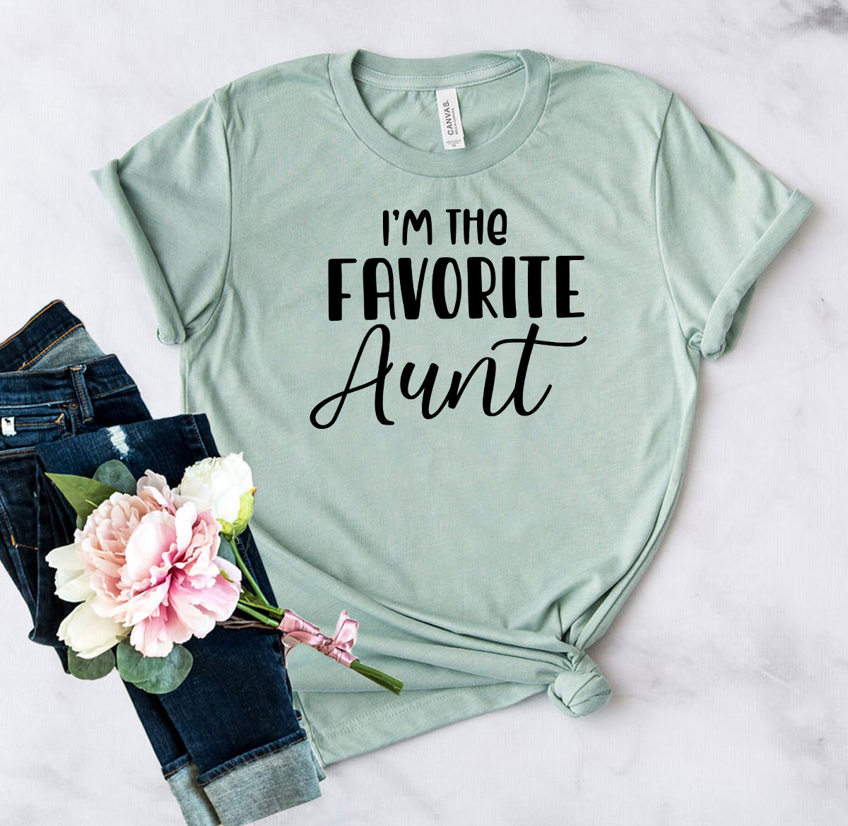 DT0934 I'm the Favorite Aunt unisex T-shirt in various colors, showcasing its soft fabric and stylish design.