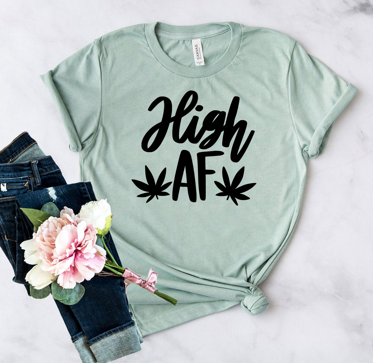 DT0940 High Af Shirt in various colors, showcasing its soft fabric and stylish design.