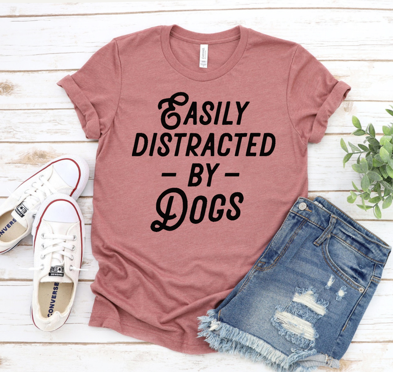 Easily Distracted By Dogs T-shirt in various sizes, showcasing a playful design for dog lovers.