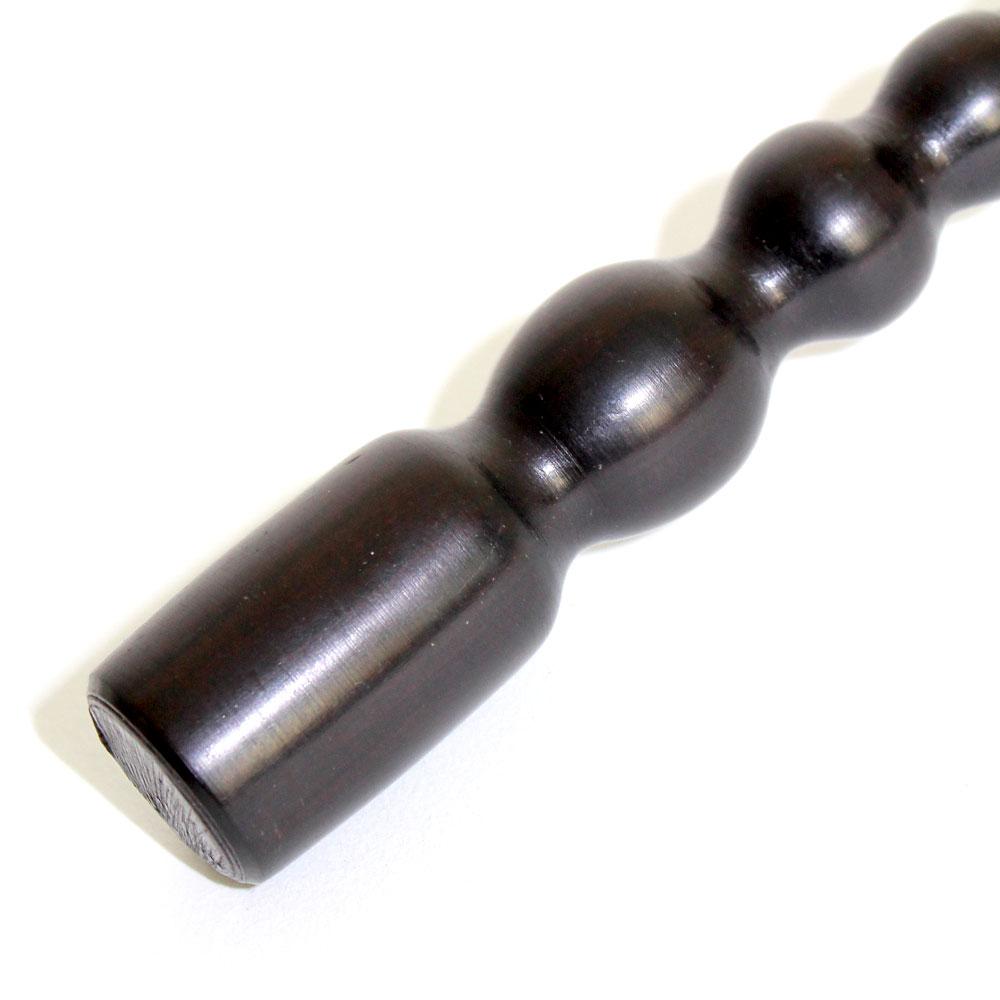 Ebony Wood African Bottle Opener showcasing its elegant design and dual functionality as a bottle opener and mallet.