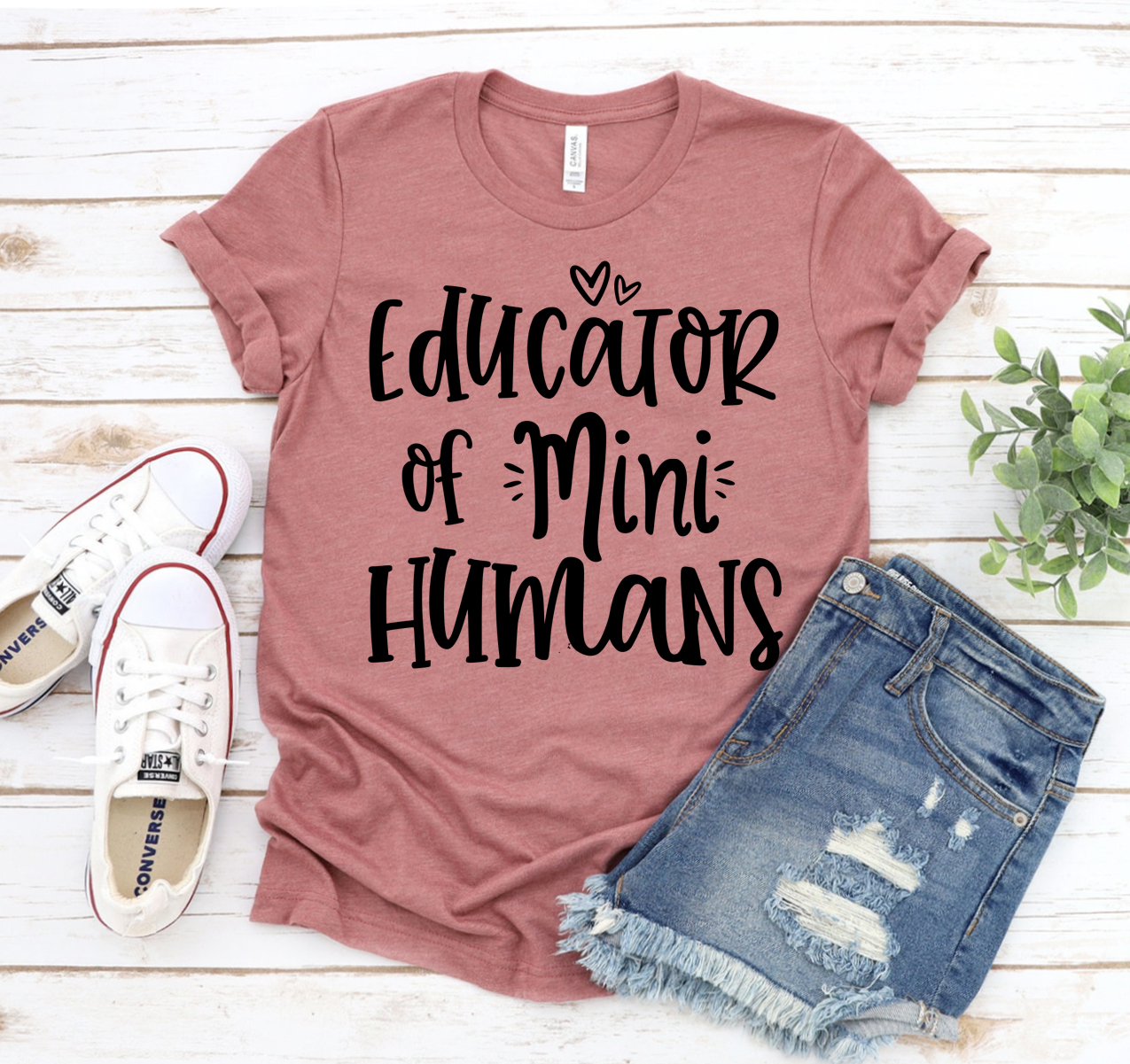 A comfortable unisex Educator Of Mini Humans T-shirt made from soft airlume combed cotton, featuring a stylish design perfect for teachers.