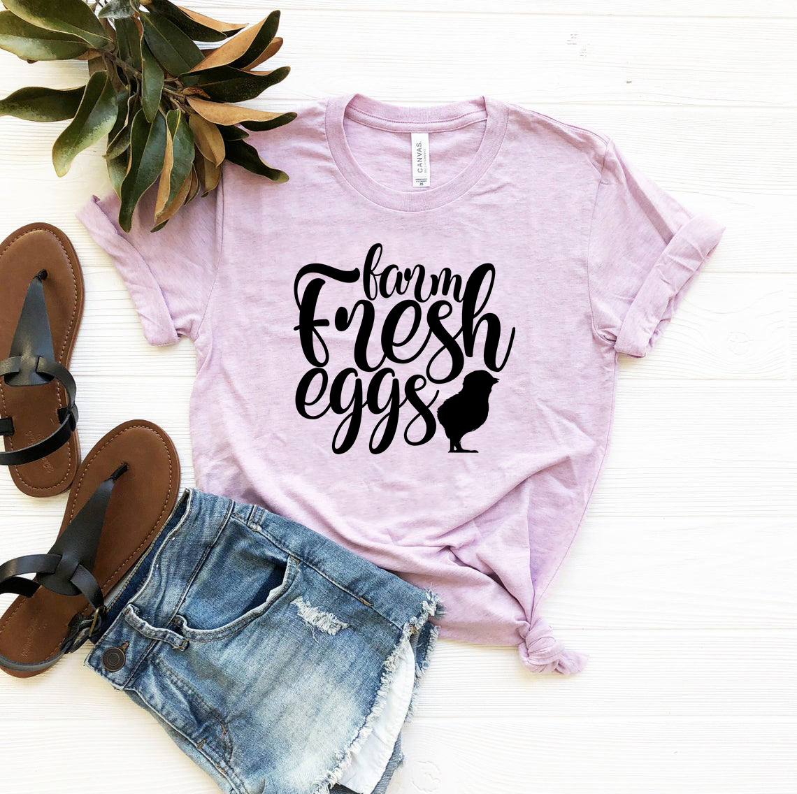 A stylish unisex T-shirt featuring a farm fresh eggs design, made from soft ring spun cotton, available in multiple colors and sizes.