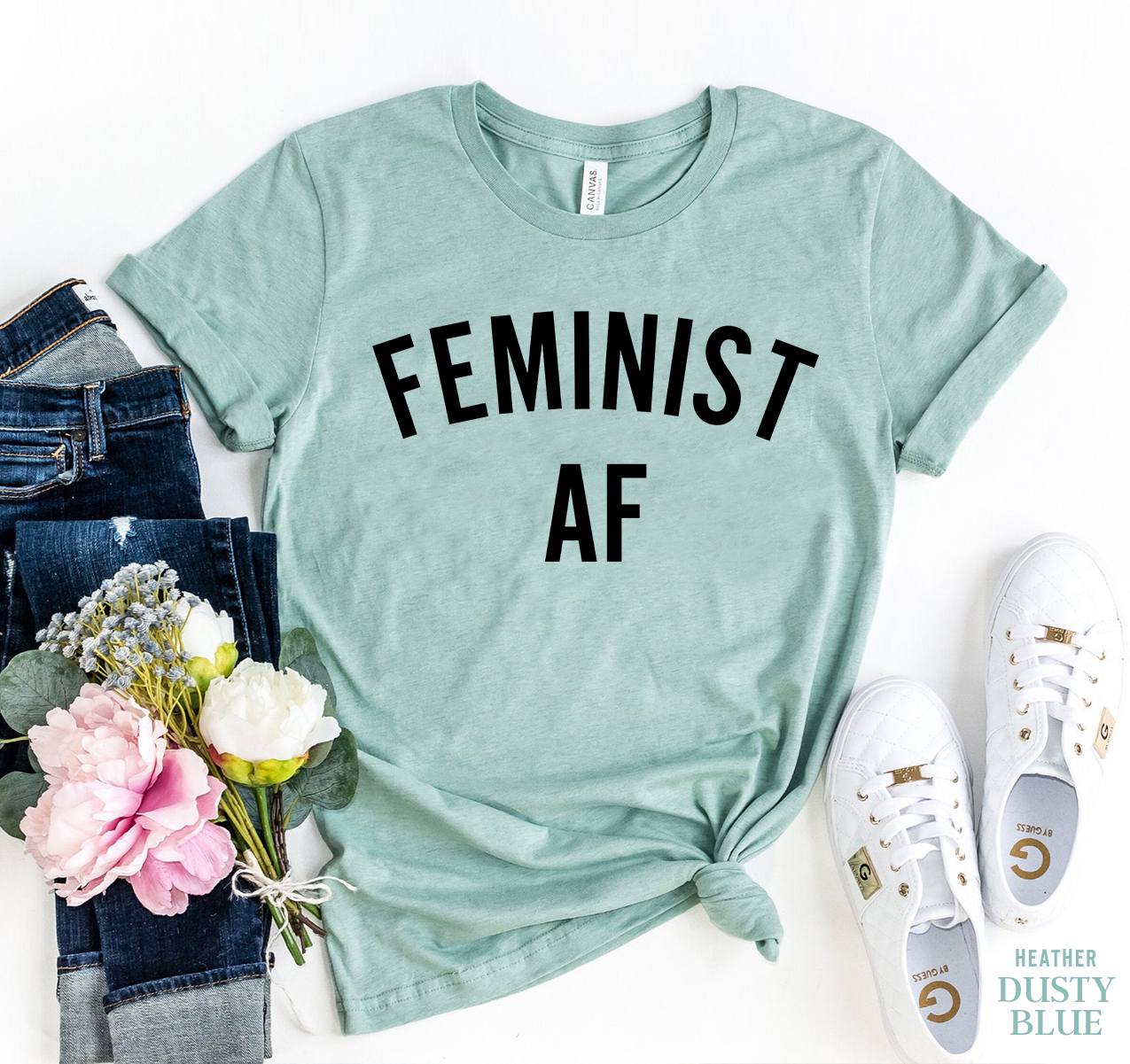 Feminist AF T-shirt made of premium ring spun cotton, featuring a bold print and available in multiple sizes.