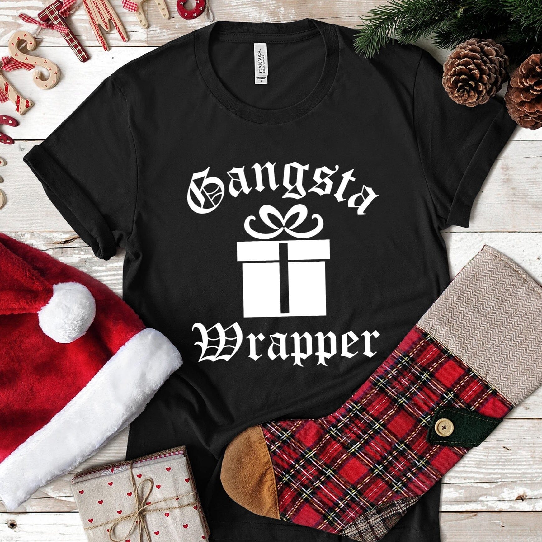 Gangsta Wrapper Christmas Tee featuring a fun design, made from 100% Ringspun Cotton, perfect for holiday celebrations.