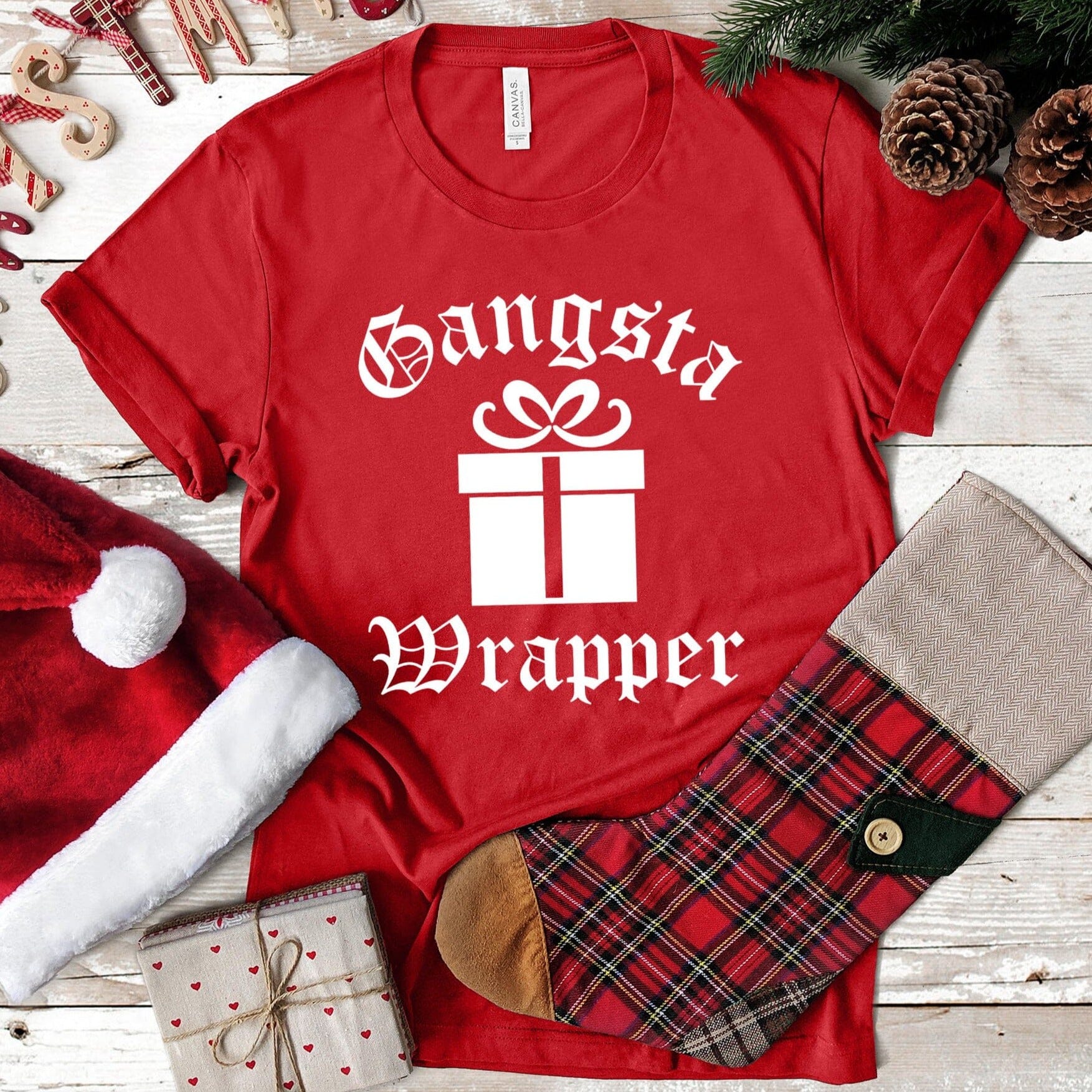 Gangsta Wrapper Christmas Tee featuring a fun design, made from 100% Ringspun Cotton, perfect for holiday celebrations.