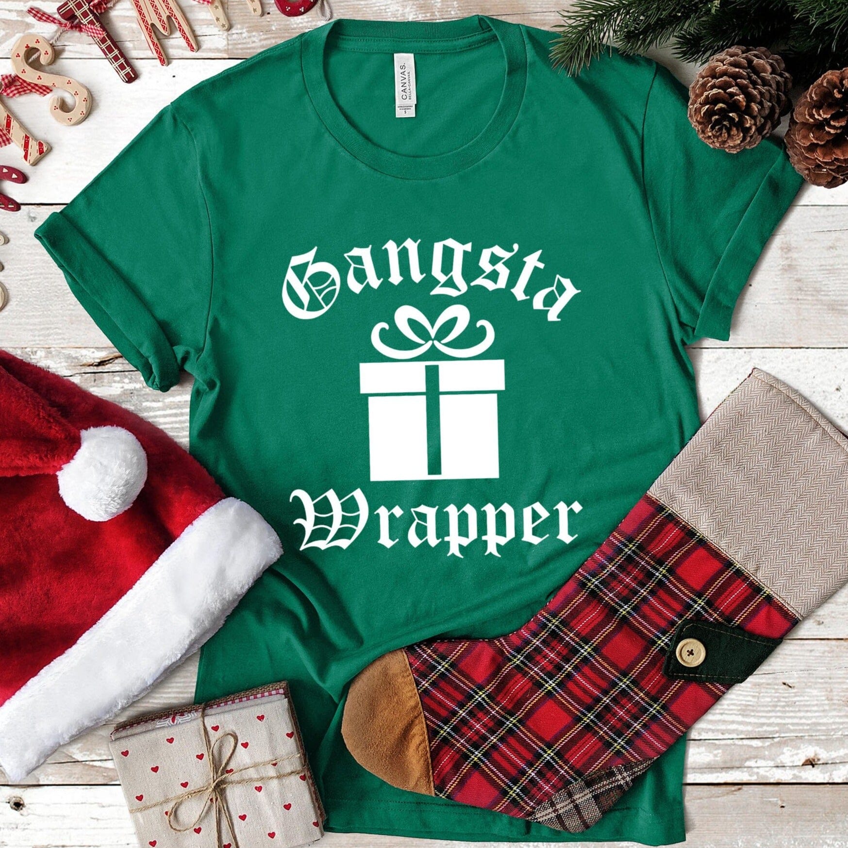 Gangsta Wrapper Christmas Tee featuring a fun design, made from 100% Ringspun Cotton, perfect for holiday celebrations.