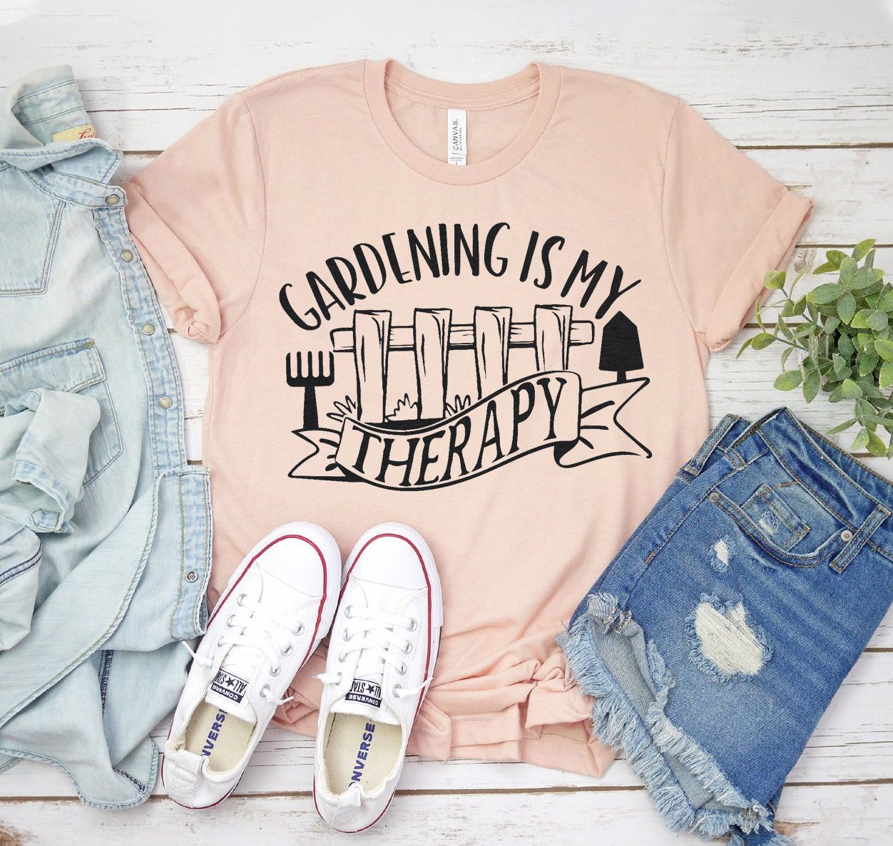 A unisex Gardening Is My Therapy Shirt made from soft airlume cotton, featuring a stylish design with the phrase 'Gardening Is My Therapy'.