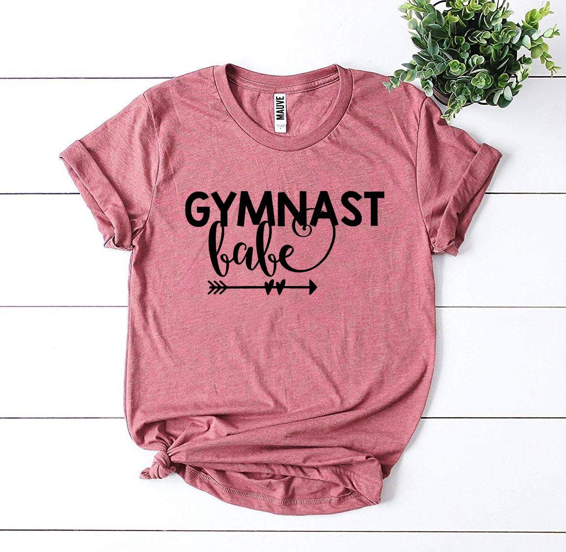 Gymnast Babe T-shirt made from premium ring spun cotton, featuring a vibrant flex print design, available in various sizes.