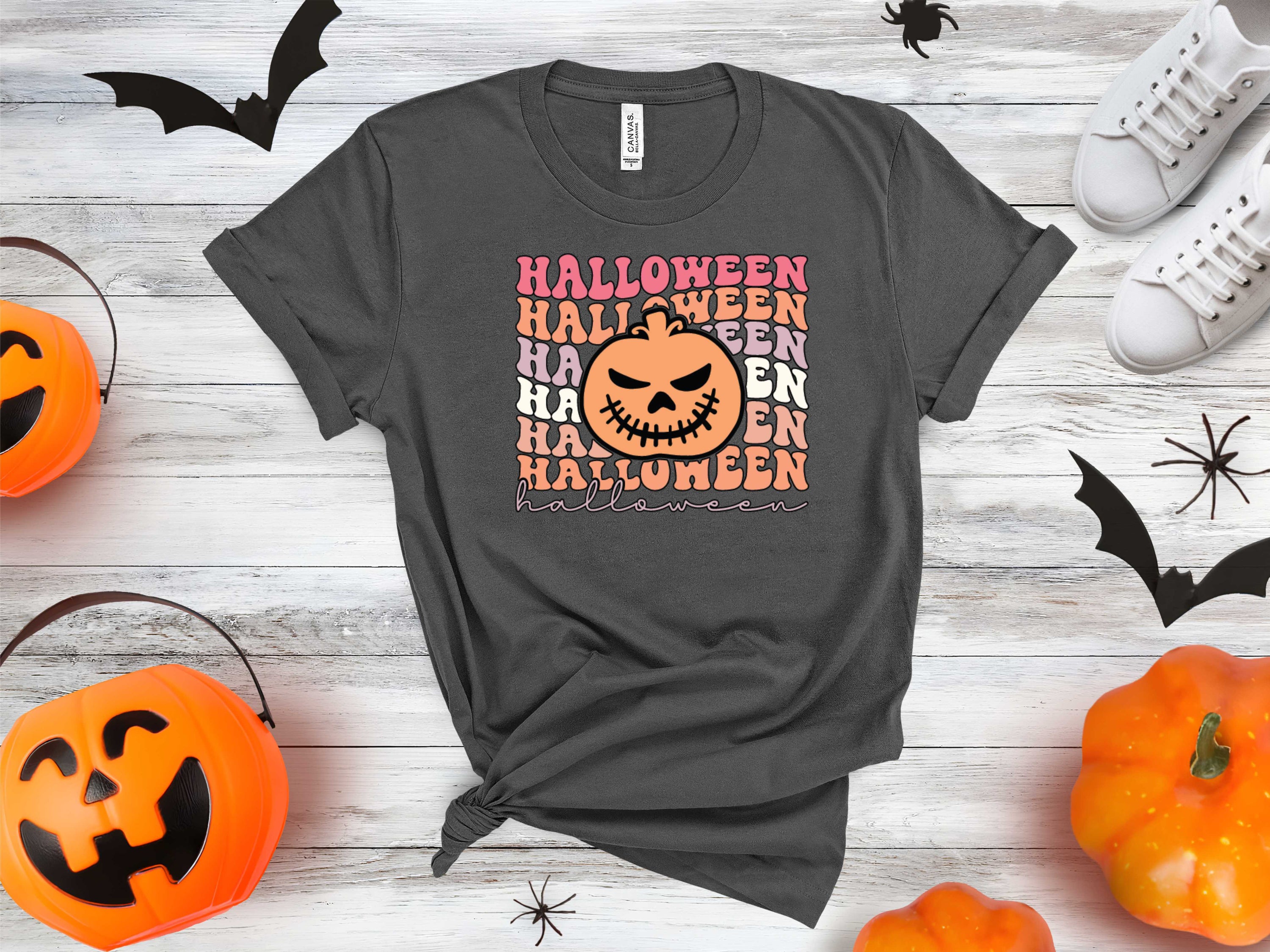 A vibrant Halloween Pumpkin graphic tee featuring a classic jack-o'-lantern design, perfect for festive celebrations.