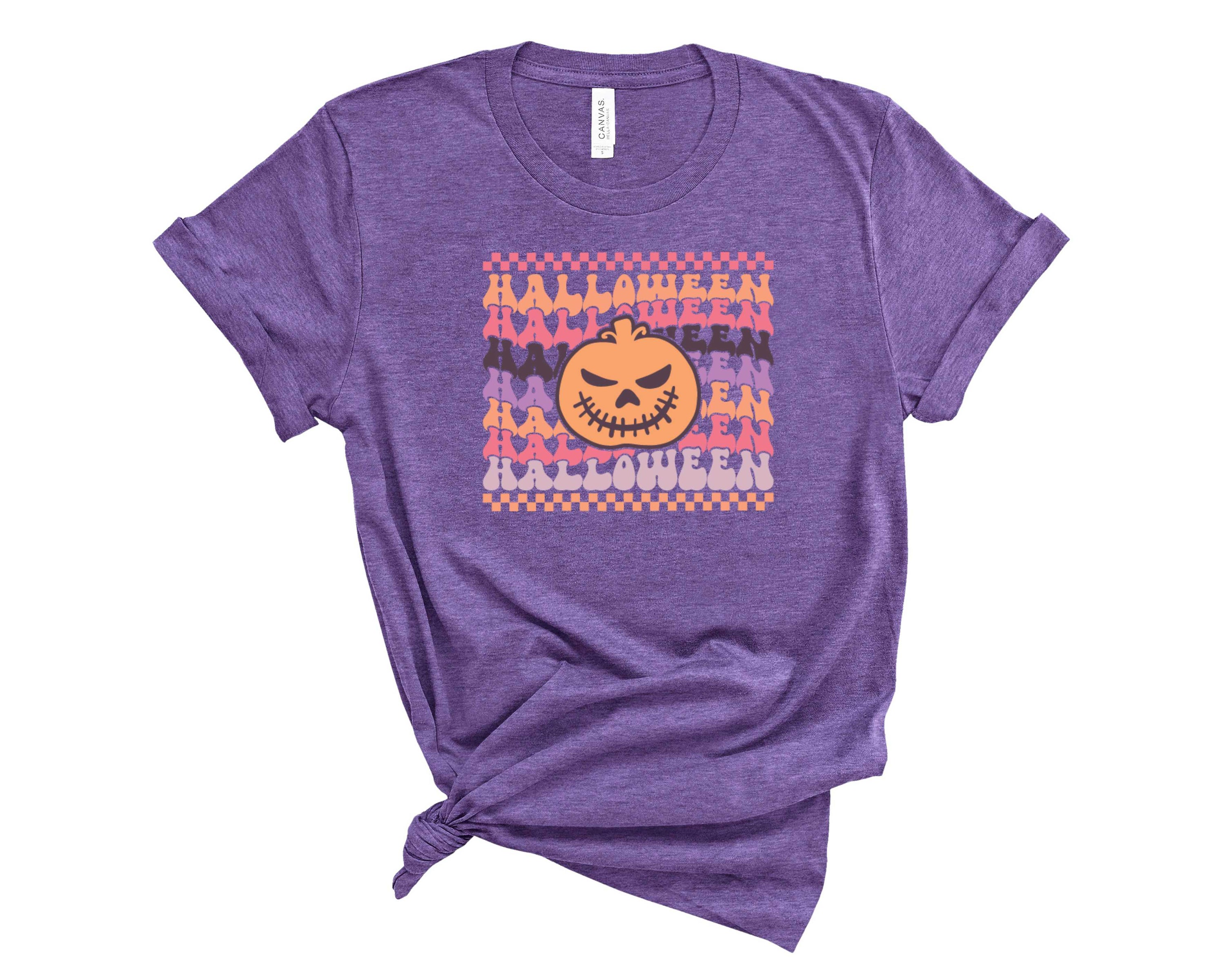 A vibrant unisex Halloween retro pumpkin graphic tee featuring a nostalgic pumpkin design, perfect for festive celebrations.