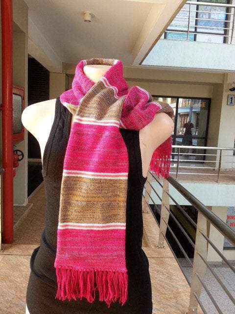 Handwoven knitted wool neck scarf in classic ribbed stitch, showcasing its warmth and versatility.
