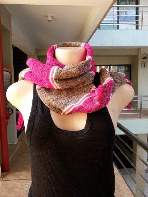 Handwoven knitted wool neck scarf in classic ribbed stitch, showcasing its warmth and versatility.