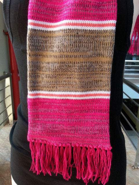 Handwoven knitted wool neck scarf in classic ribbed stitch, showcasing its warmth and versatility.
