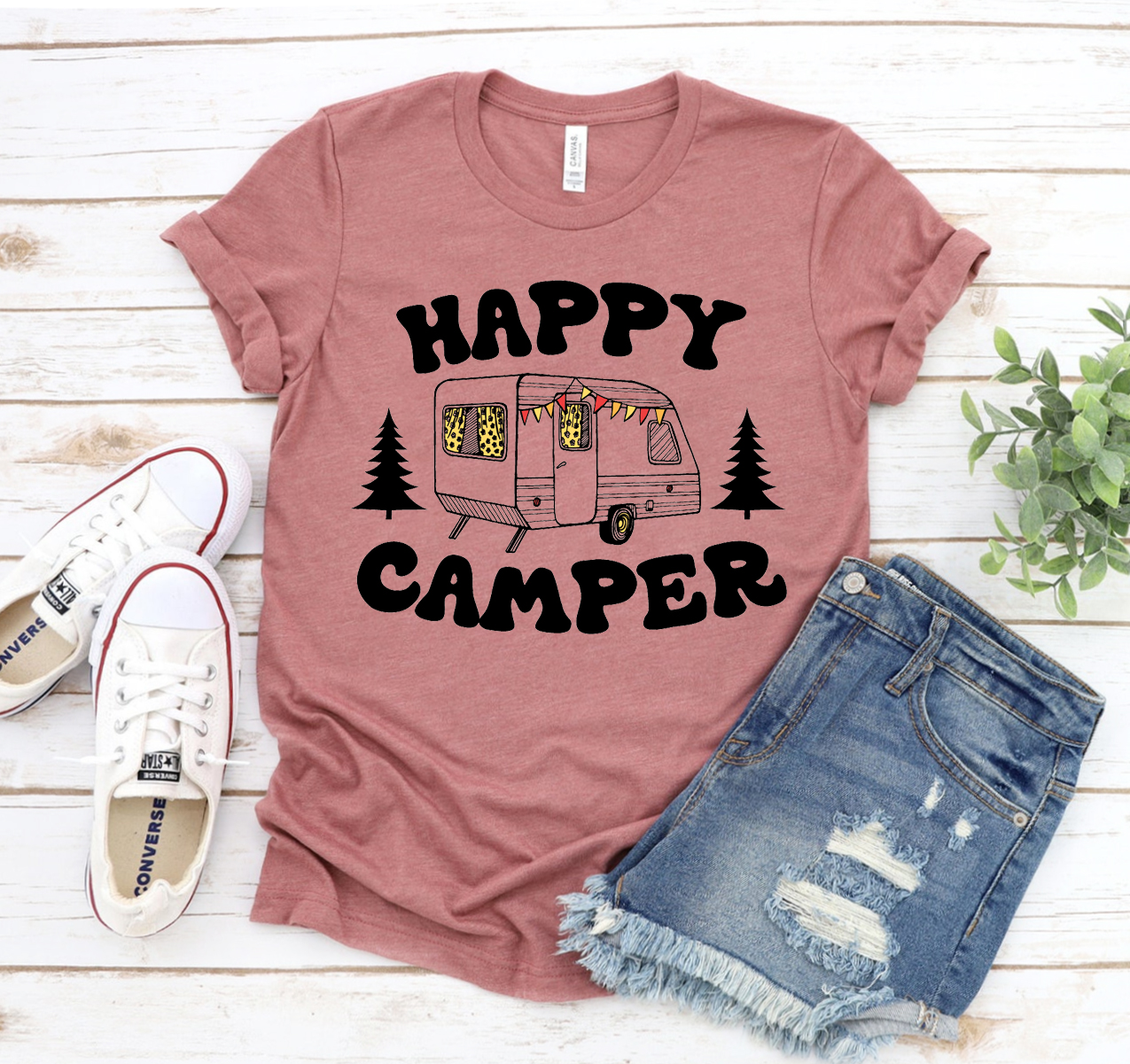 Happy Camper T-shirt in various sizes, showcasing its unisex design and soft fabric.