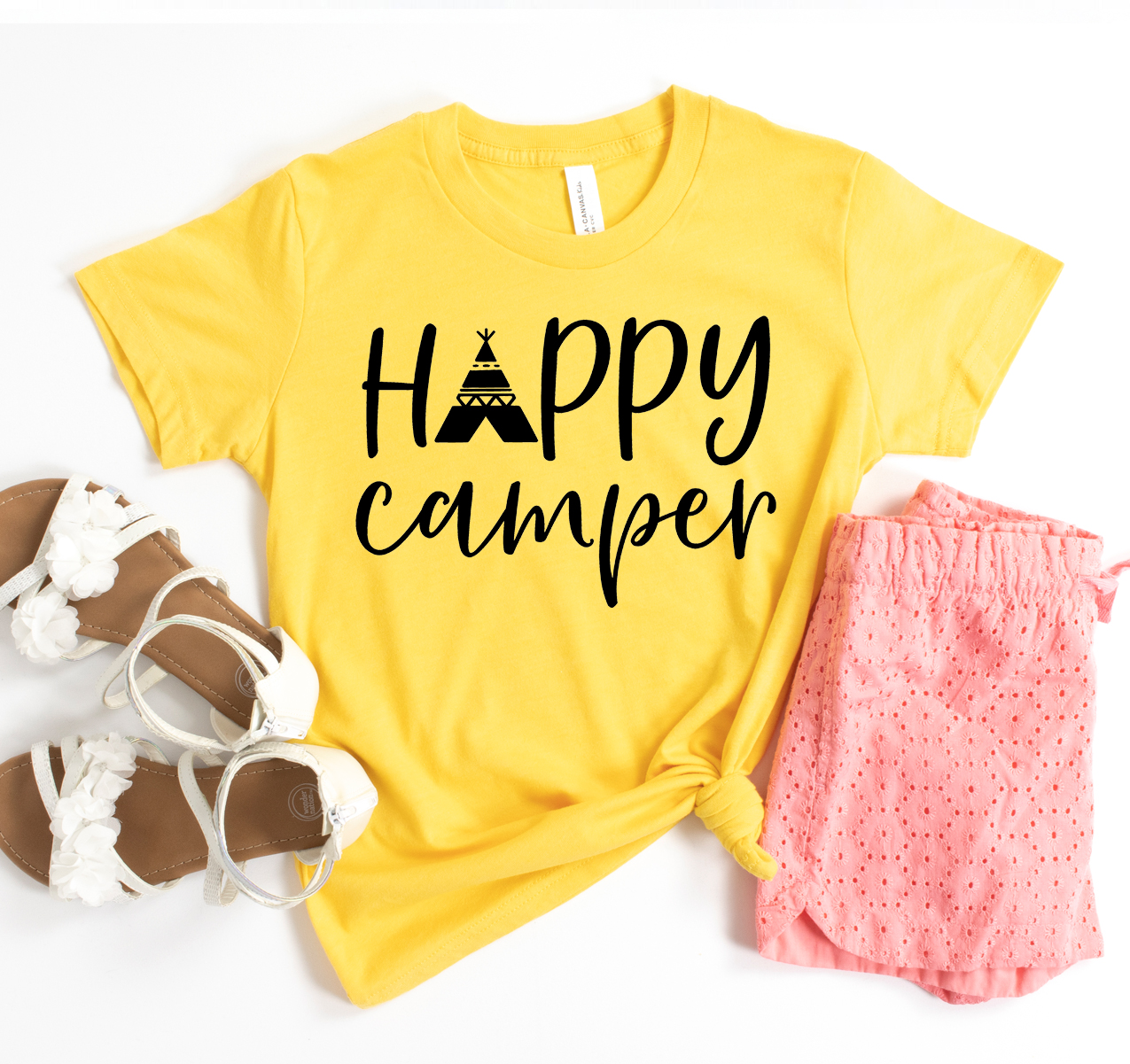 Happy Camper T-shirt in various sizes, showcasing its unisex design and soft fabric.