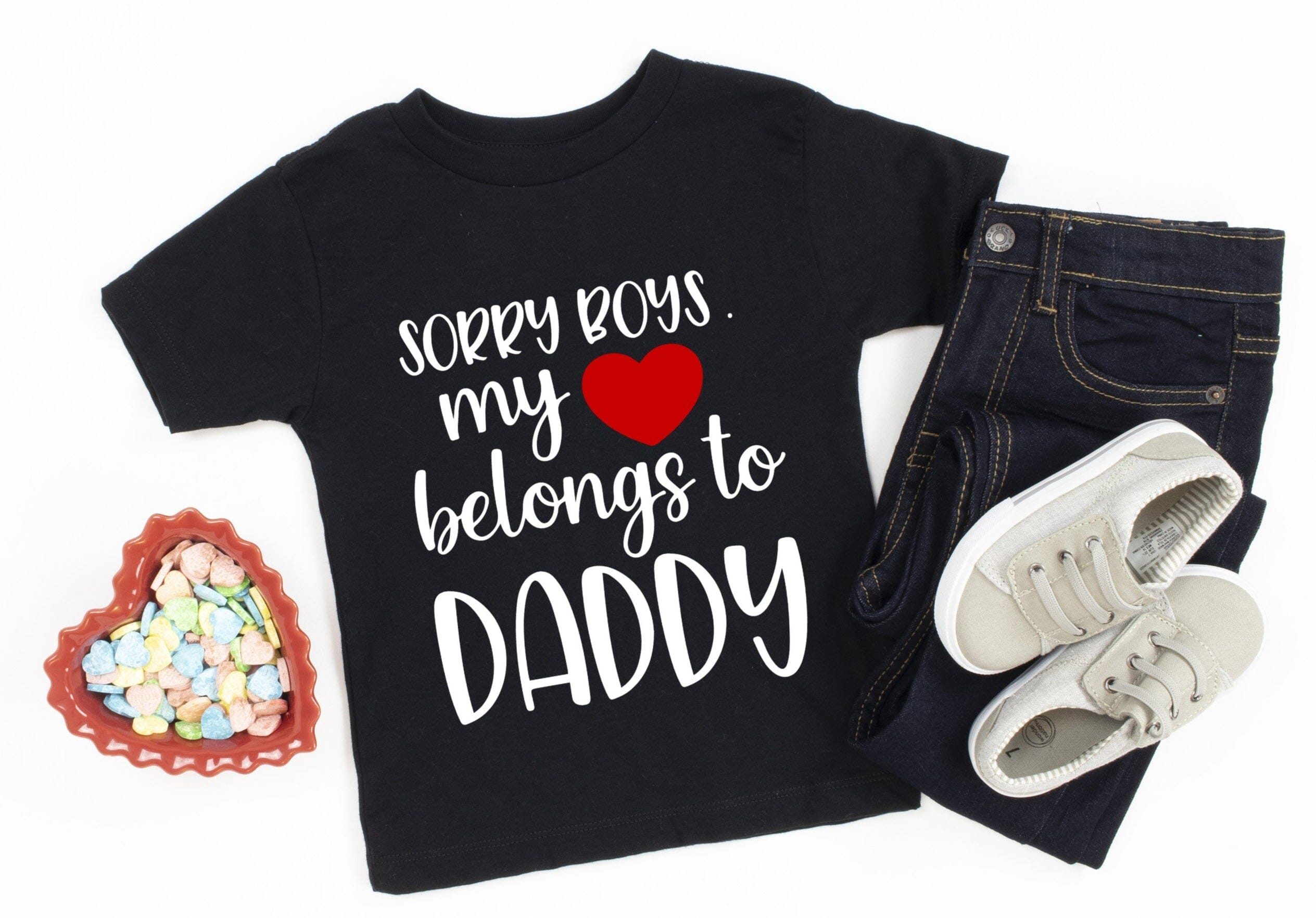 A cute baby wearing a Heart Belongs To Daddy Onesie, showcasing its comfy design and vibrant color.