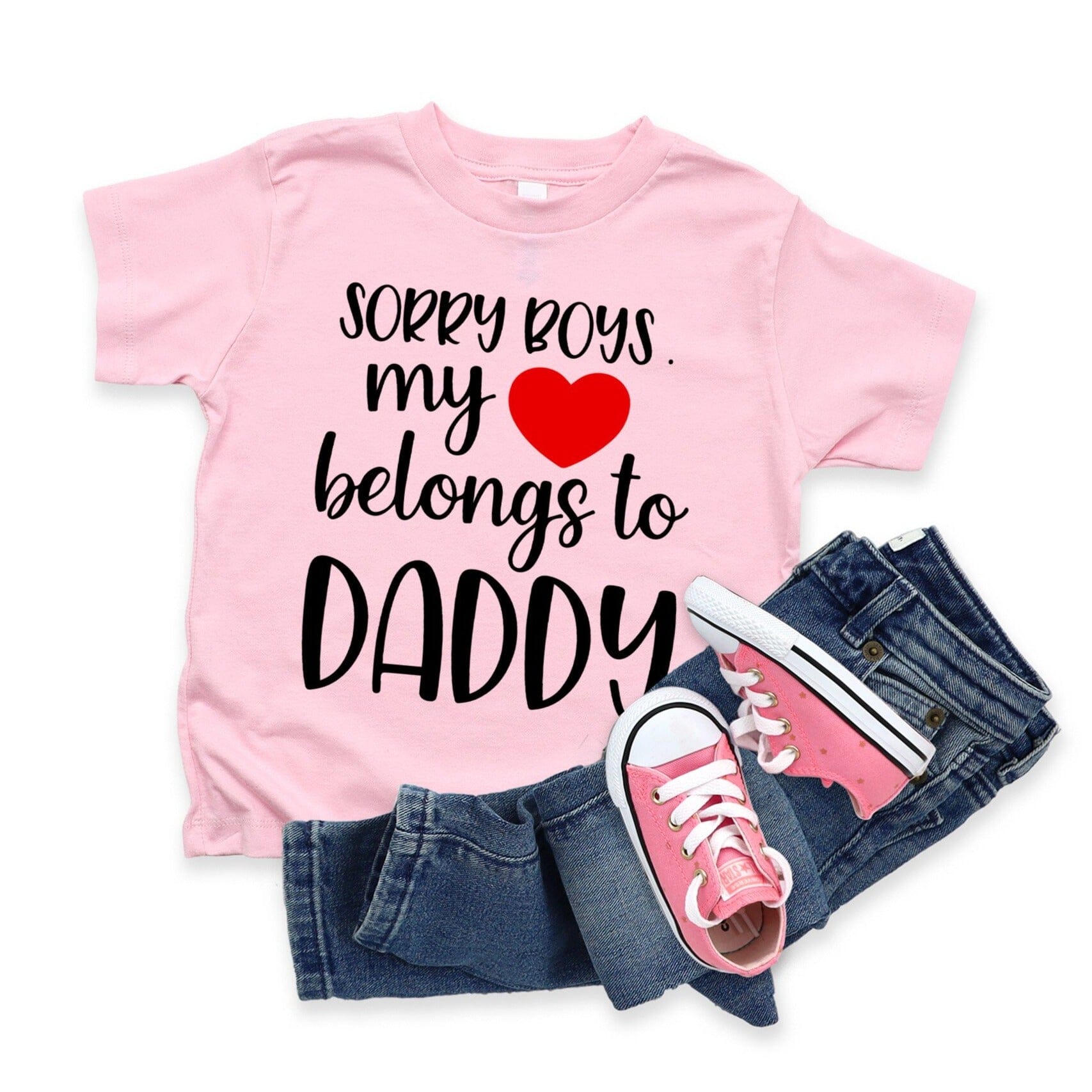 A cute baby wearing a Heart Belongs To Daddy Onesie, showcasing its soft fabric and playful design.