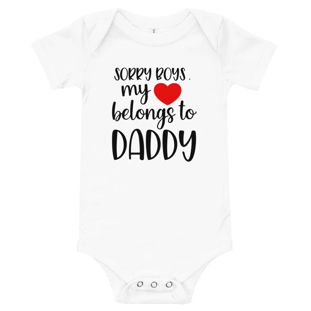 A cute baby wearing a Heart Belongs To Daddy Onesie, showcasing its soft fabric and playful design.