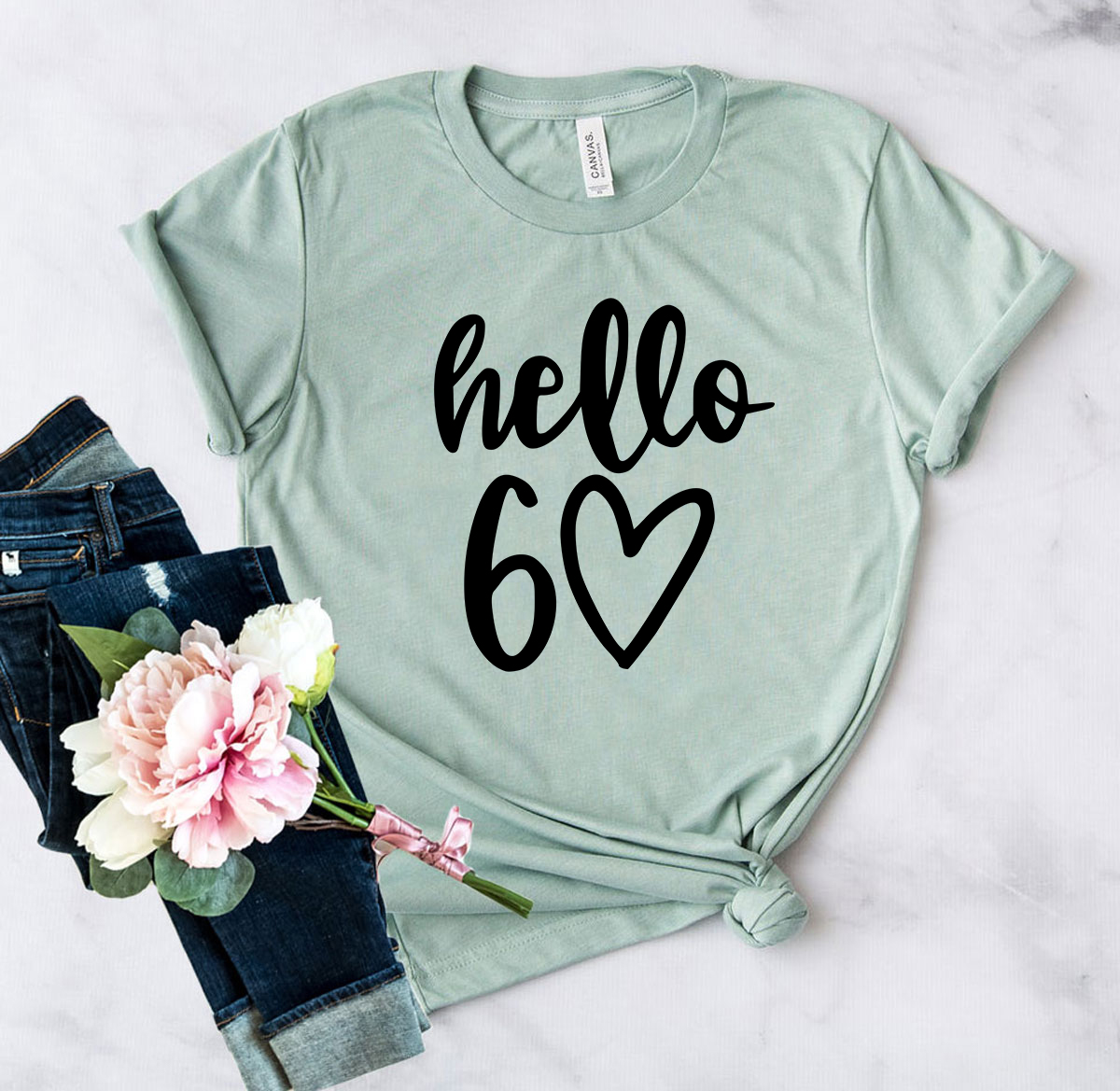 Hello 60 Unisex T-shirt in various colors, showcasing its soft fabric and stylish design.