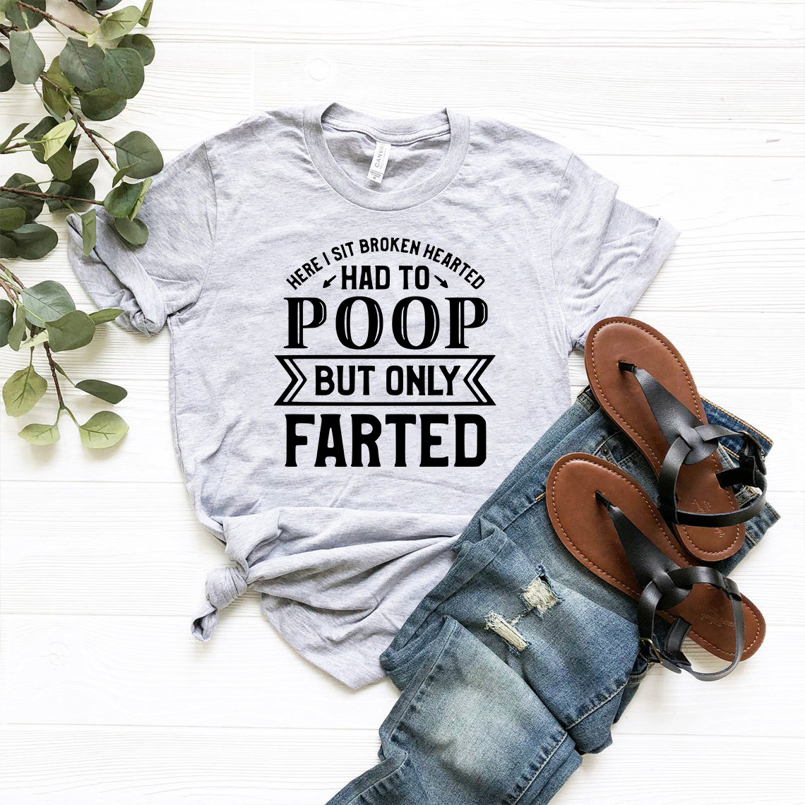 Here I Sit Broken Hearted Shirt in various colors, showcasing its soft fabric and stylish design.