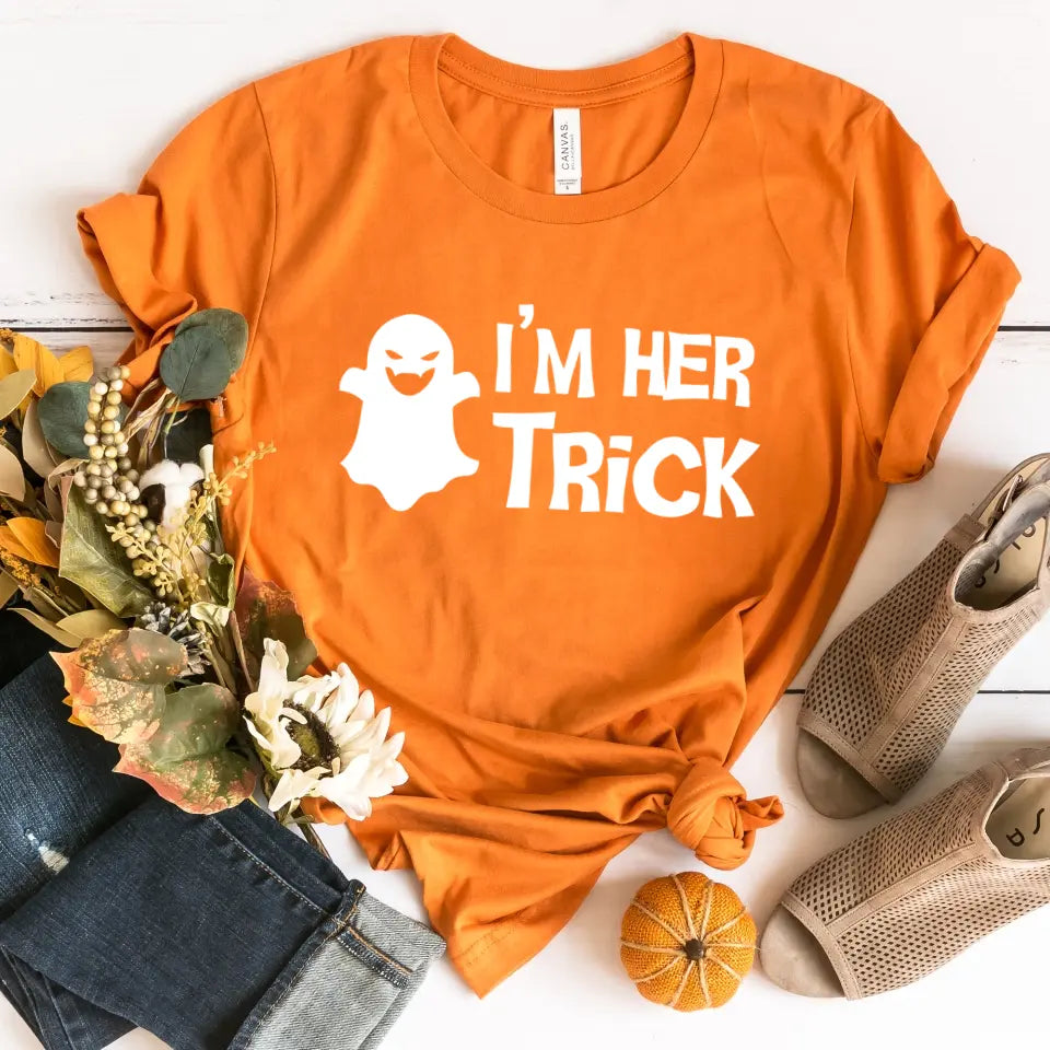 His Trick and Her Treat Couples Halloween Tees displayed on a neutral background, showcasing their fun Halloween-themed designs.