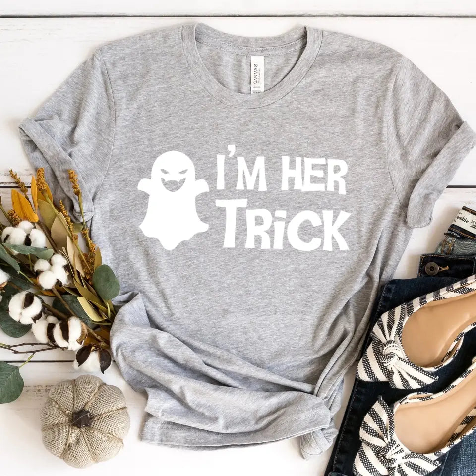 His Trick and Her Treat Couples Halloween Tees displayed on a neutral background, showcasing their fun Halloween-themed designs.