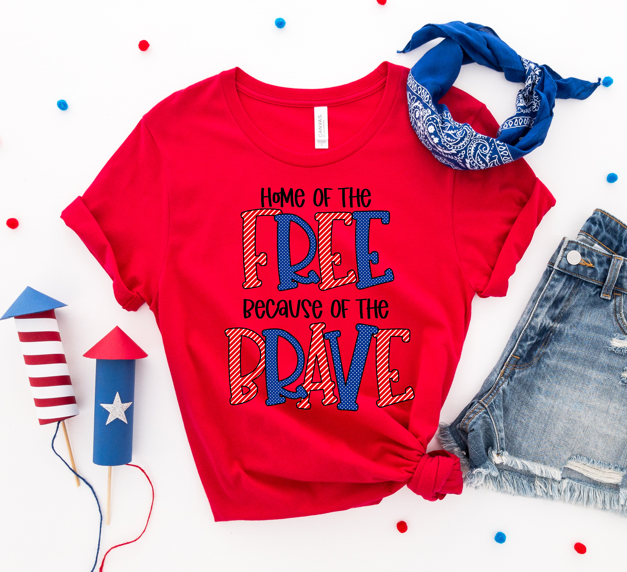 A patriotic T-shirt featuring the phrase 'Home of the Free Because of the Brave', made from soft ring spun cotton with a high-quality print.