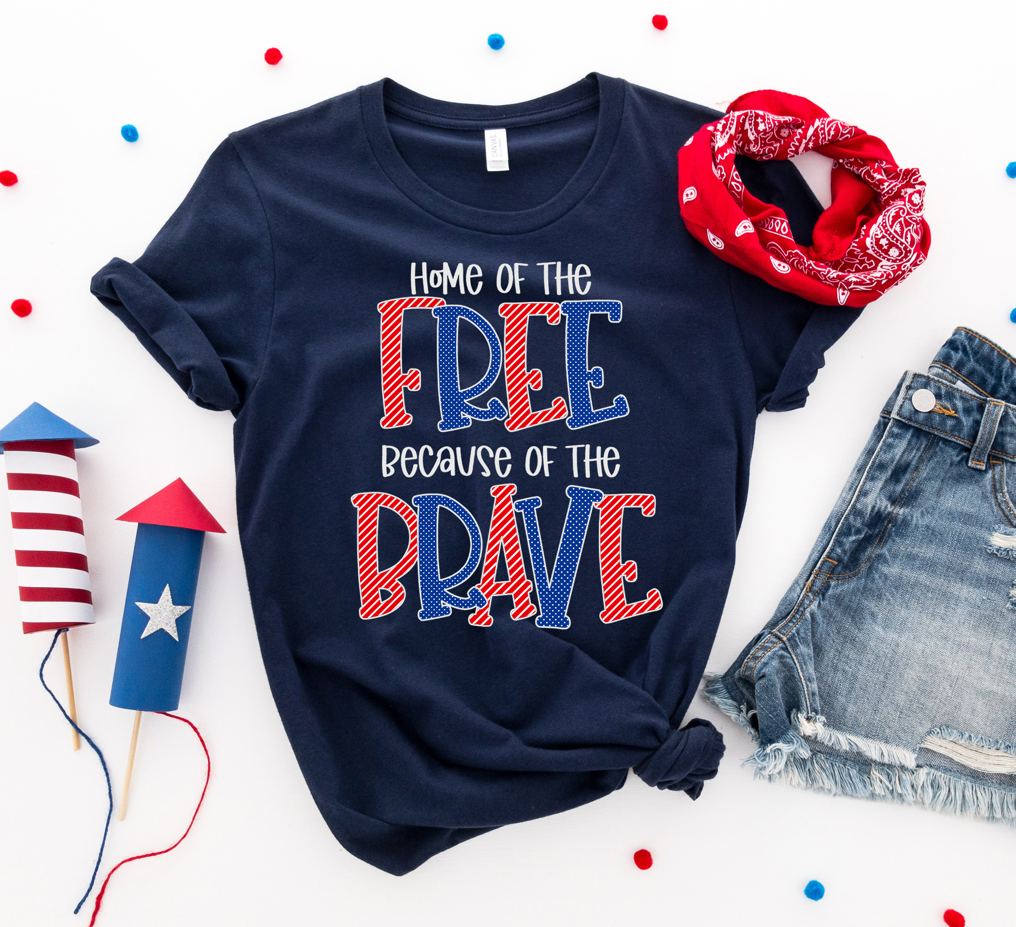 A patriotic T-shirt featuring the phrase 'Home of the Free Because of the Brave', made from soft ring spun cotton with a high-quality print.