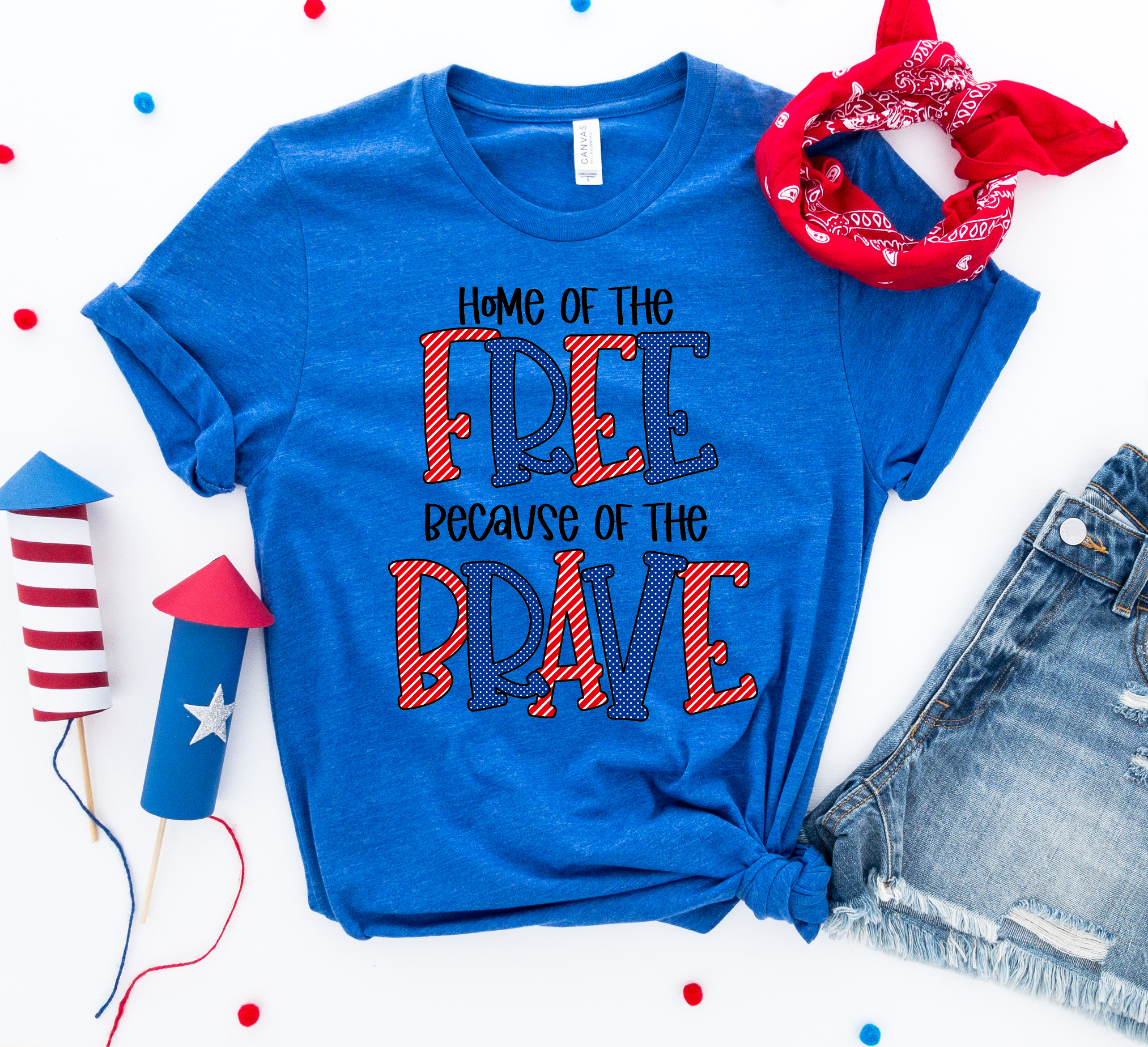 A patriotic T-shirt featuring the phrase 'Home of the Free Because of the Brave', made from soft ring spun cotton with a high-quality print.