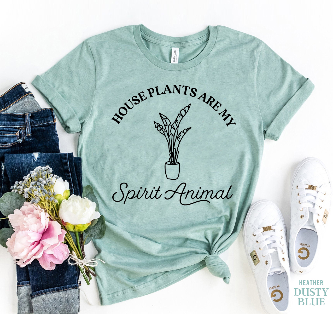 A comfortable unisex t-shirt featuring the phrase 'Houseplants Are My Spirit Animal' in a stylish font, perfect for plant lovers.
