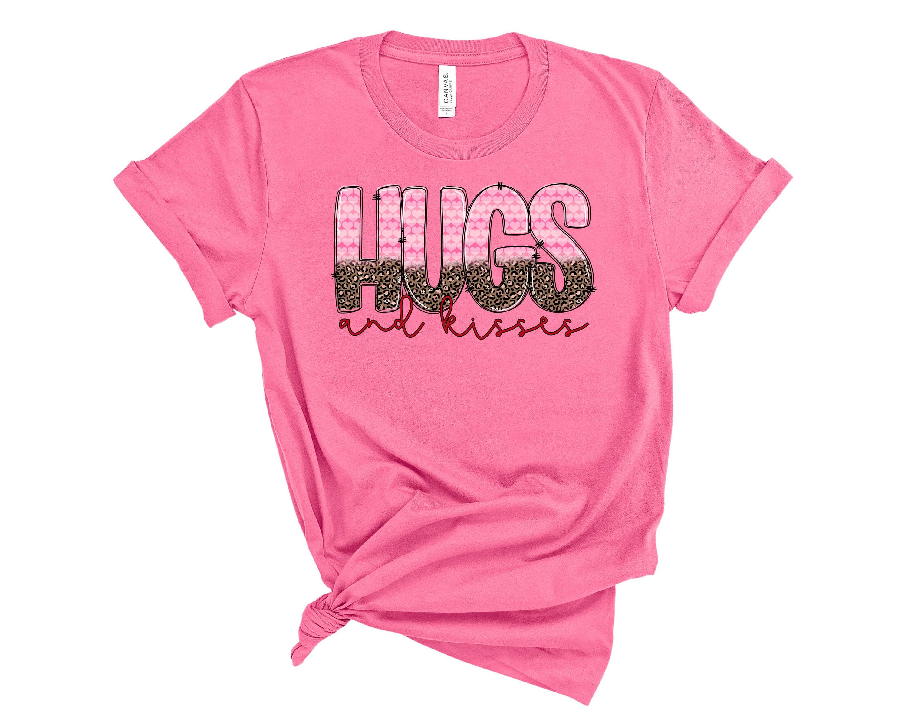 Hugs & Kisses Graphic Tee featuring a playful design on a soft unisex t-shirt.