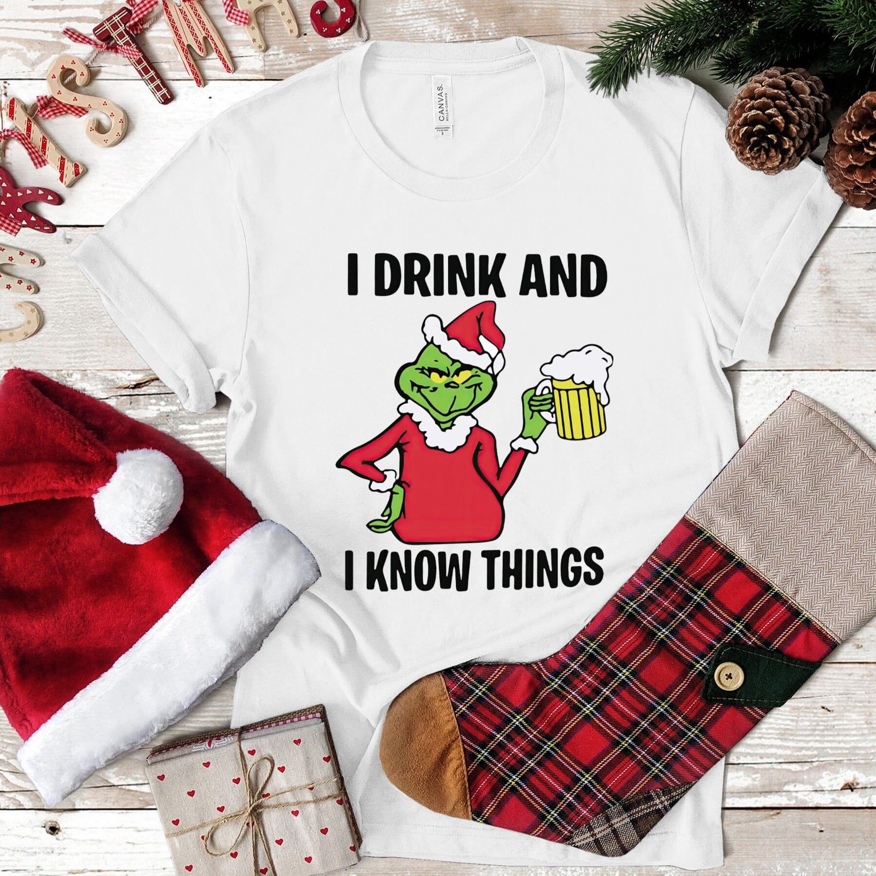 I Drink & I Know Things Christmas Tee featuring a witty design on a comfortable, unisex t-shirt made from 100% Ringspun Cotton.