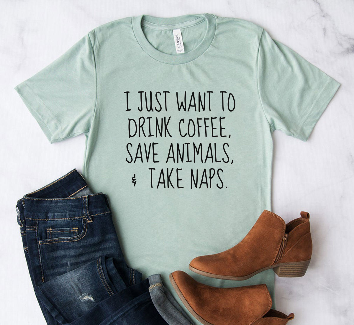 Unisex T-shirt featuring the phrase 'I Just Want To Drink Coffee, Save Animals' in a stylish design, available in multiple colors.