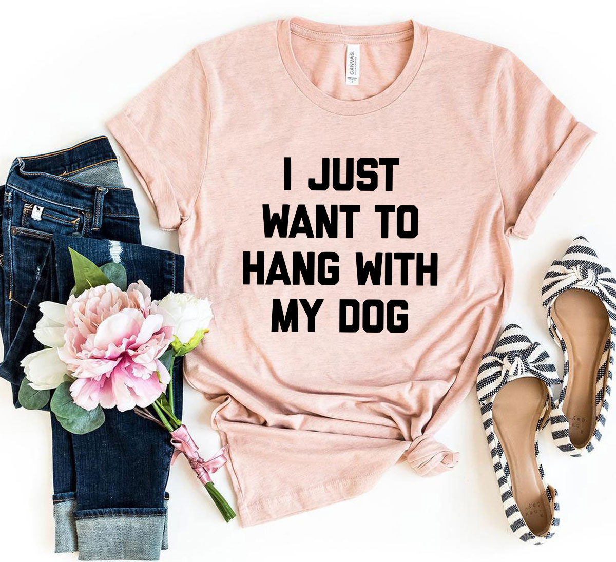 A comfortable unisex T-shirt featuring the phrase 'I Just Want To Hang With My Dog', made from soft ring spun cotton.