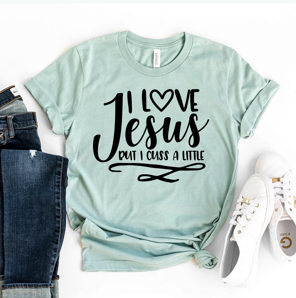 I Love Jesus But I Cuss A Little T-shirt made of premium cotton, featuring a humorous design with soft textile flex print.