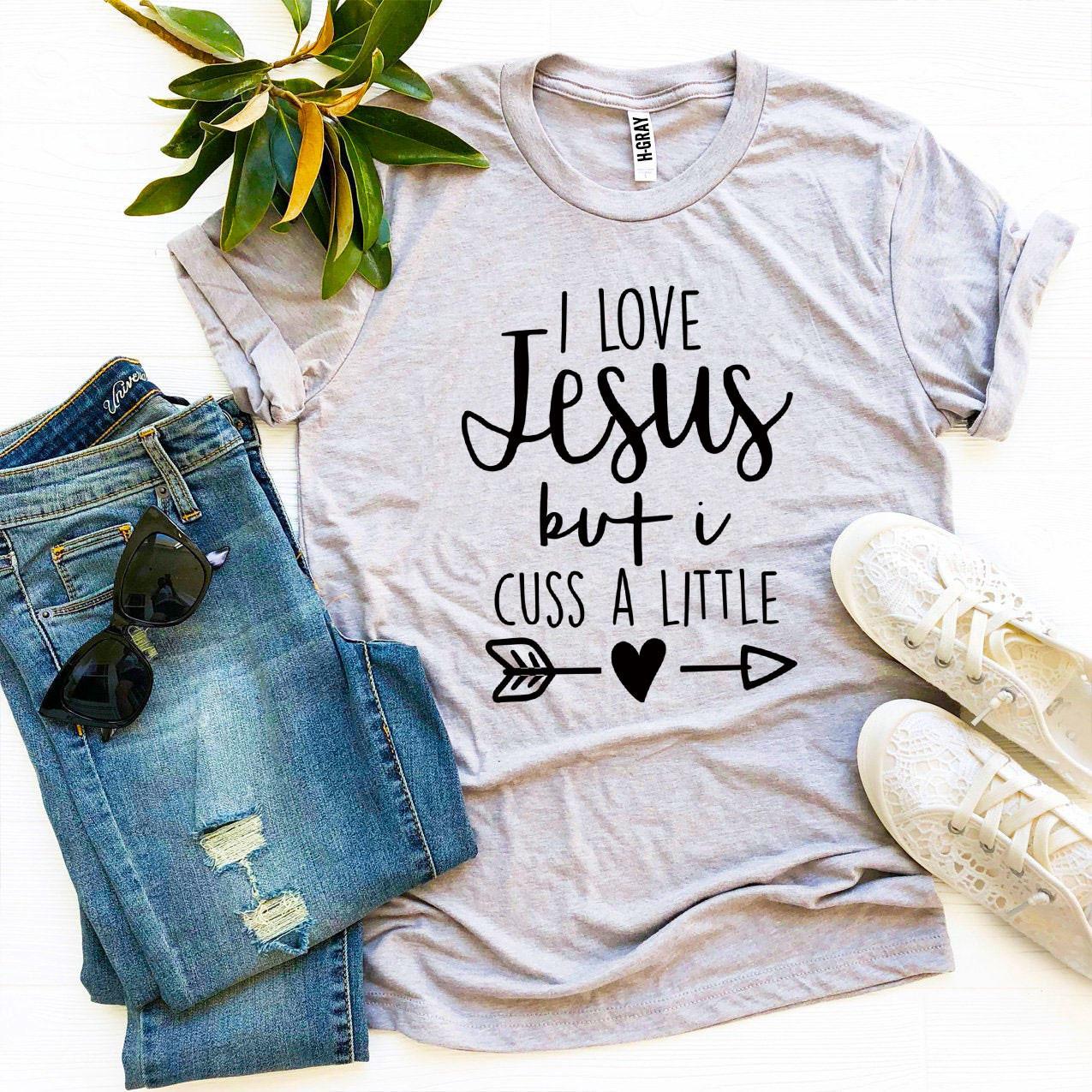 I Love Jesus But I Cuss a Little T-shirt in premium quality cotton with a humorous design.
