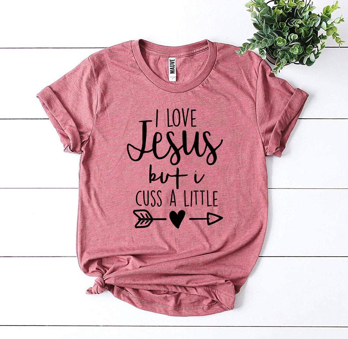 I Love Jesus But I Cuss a Little T-shirt in premium quality cotton with a humorous design.
