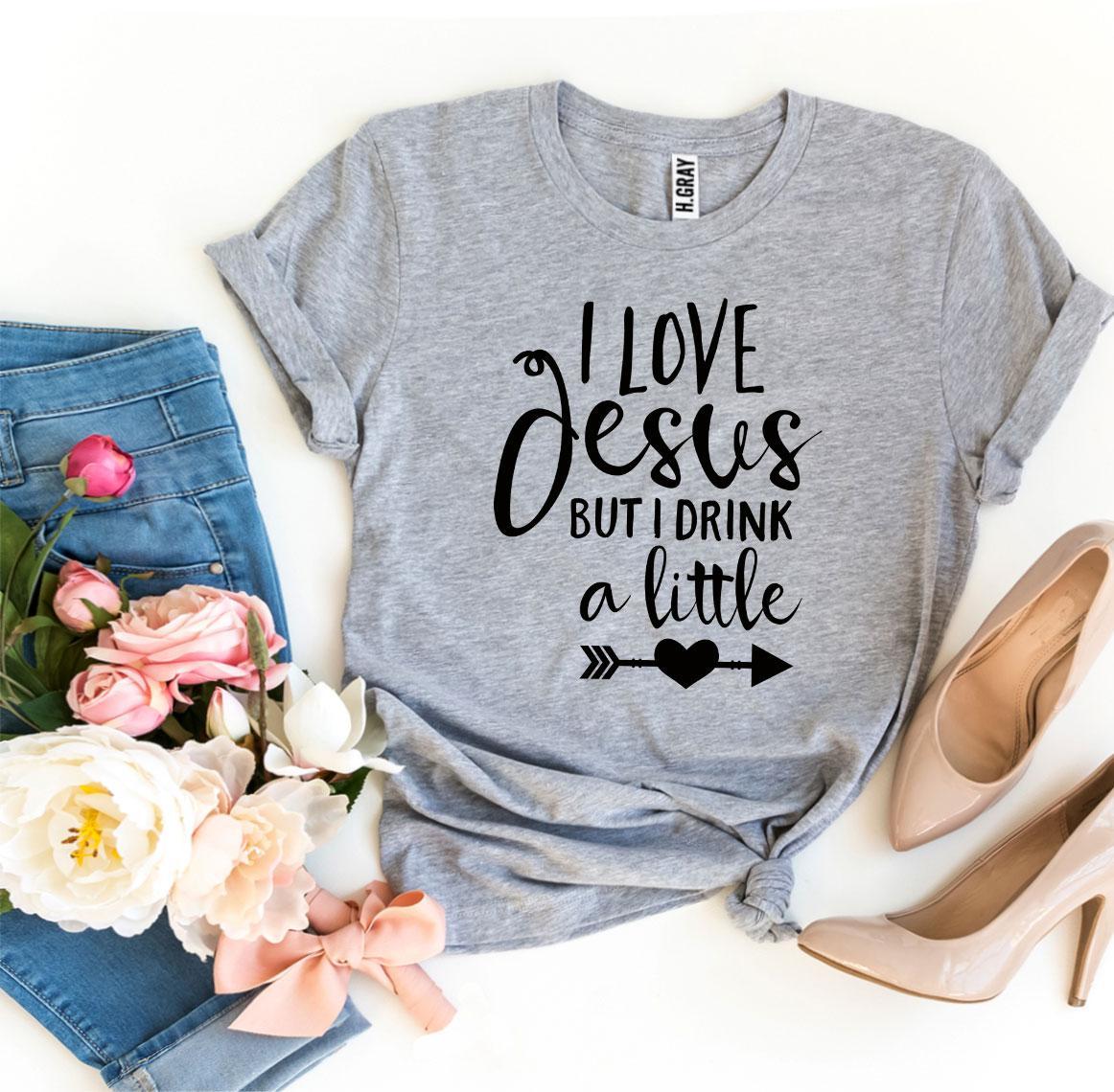 I Love Jesus But I Drink a Little T-shirt made from premium ring spun cotton, featuring a playful design and comfortable fit.