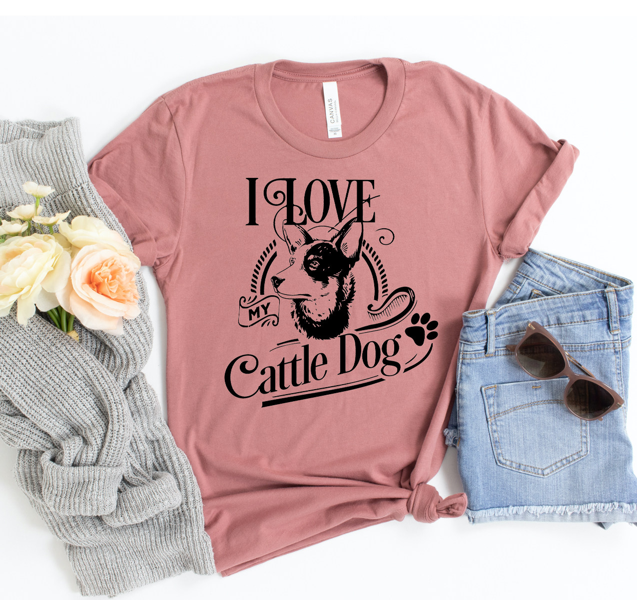 I Love My Cattle Dog T-shirt displayed on a hanger, featuring a vibrant graphic design that showcases a cattle dog.