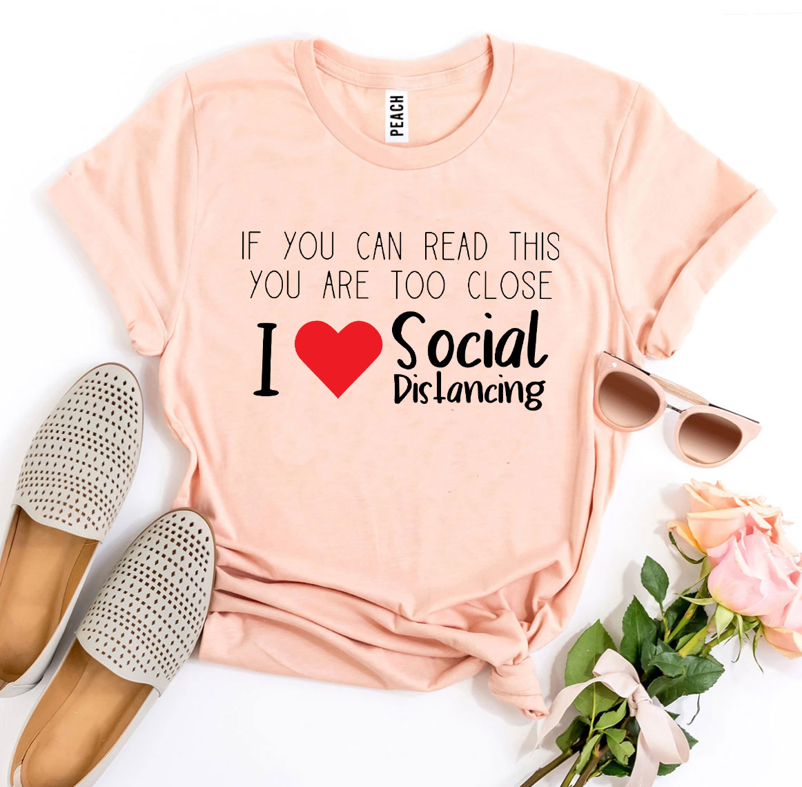 I Love Social Distancing T-shirt made of soft ring spun cotton with a vibrant print, available in various sizes.