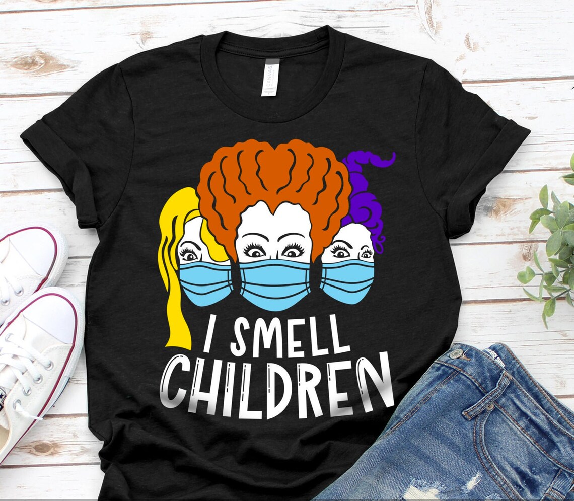 I Smell Children Halloween T-shirt featuring a playful design on premium cotton fabric.