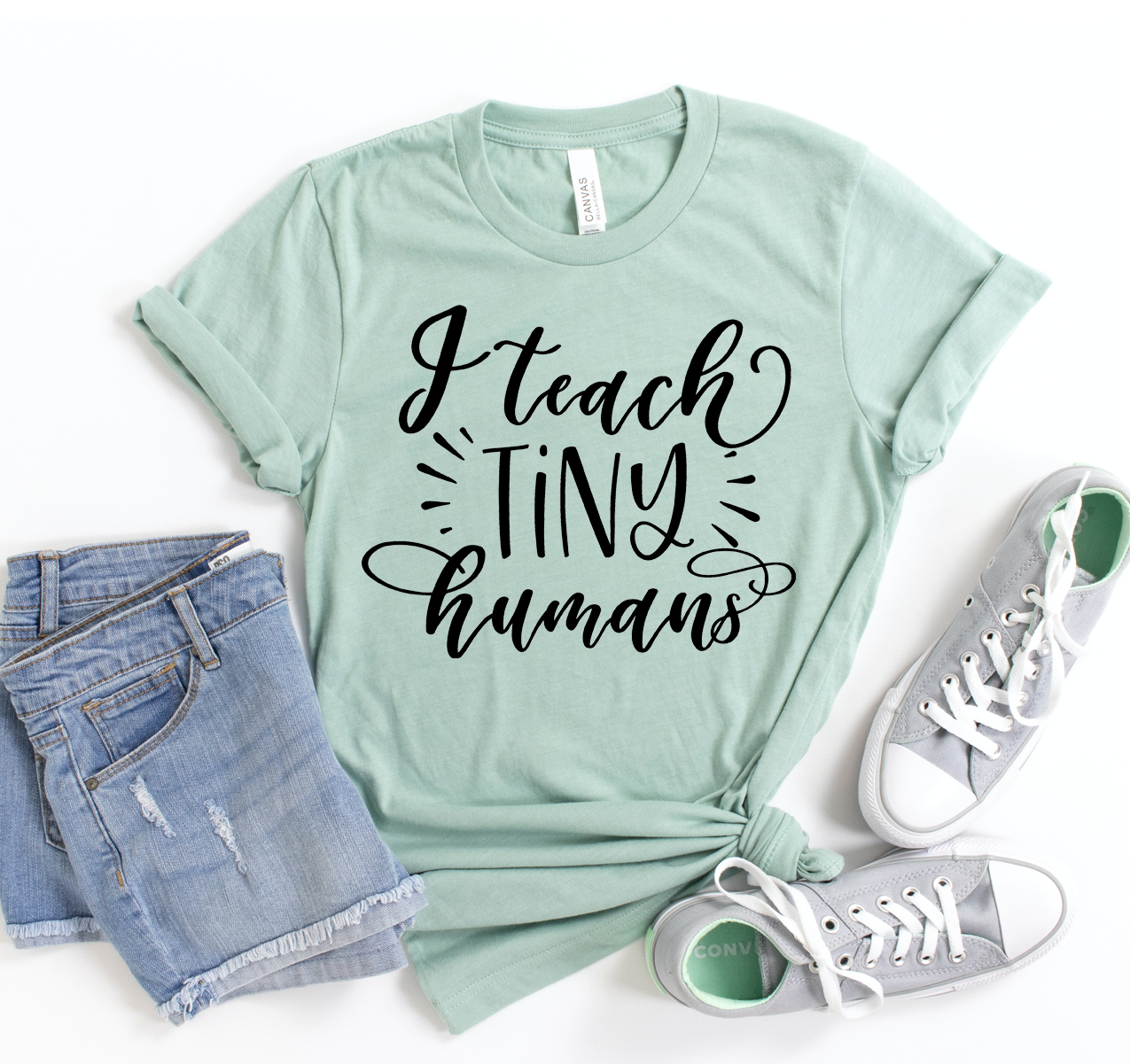 I Teach Tiny Humans T-shirt in a classic unisex style, made from soft cotton, featuring a playful teaching-themed design.