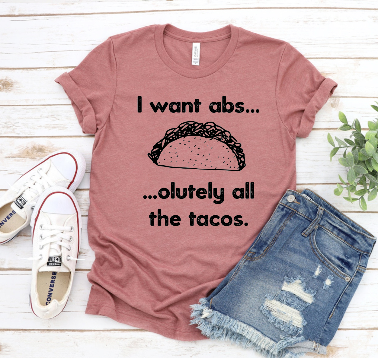 A unisex Bella Canvas 3001 T-shirt featuring the humorous phrase 'I Want Abs.. Absolutely All The Tacos' in bold lettering.