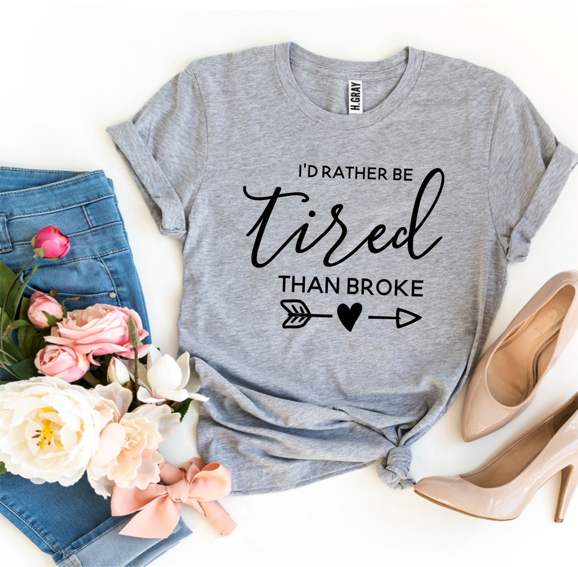 I’d Rather Be Tired Than Broke T-shirt in premium ring spun cotton, featuring a motivational print and available in various sizes.