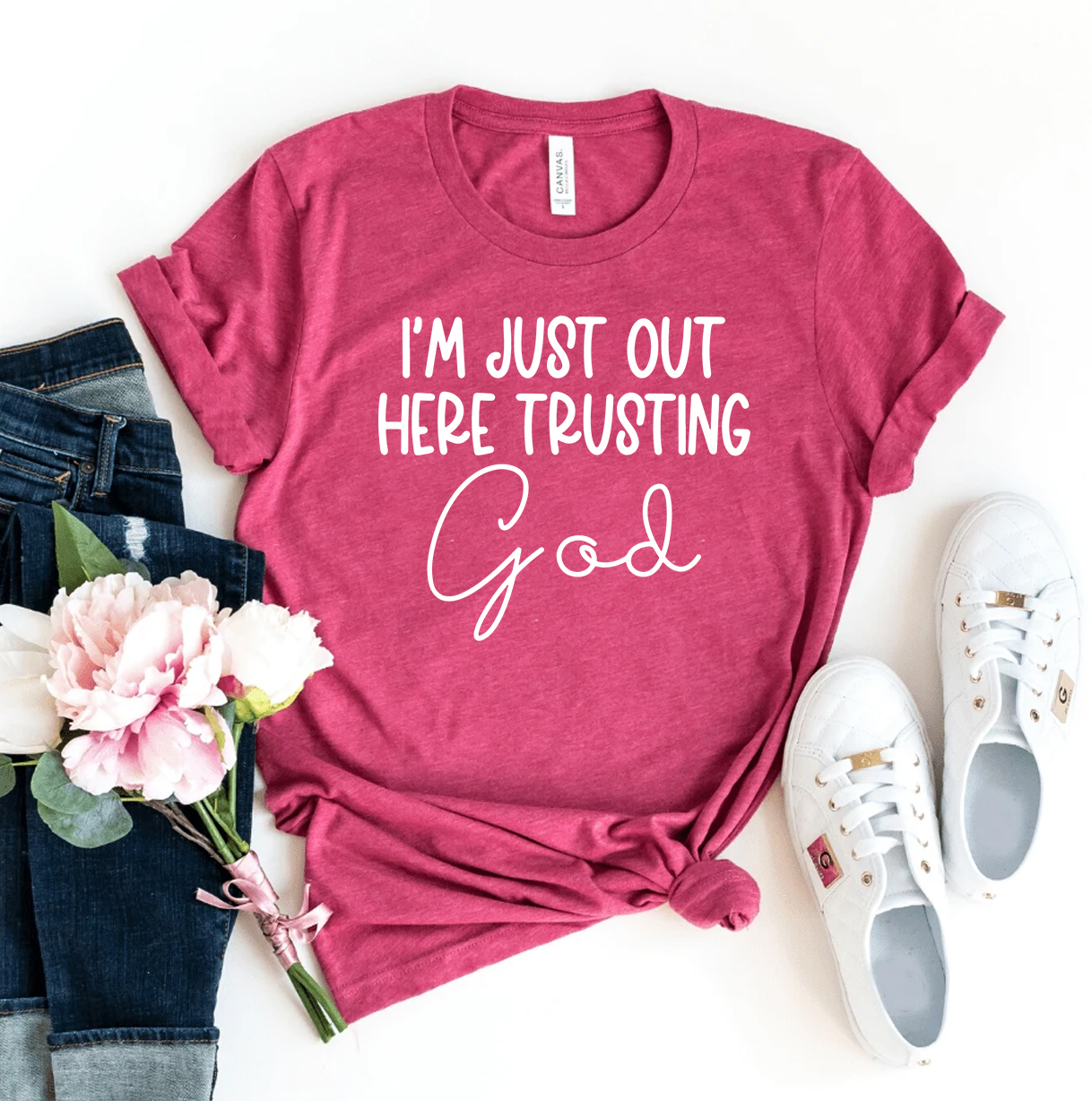 I'm Just Out Here Trusting God T-shirt made of premium ring spun cotton, featuring a high-quality flex print design.