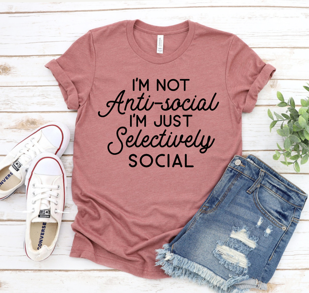 Black T-shirt featuring the phrase 'I'm Not Antisocial I'm Just Selectively Social' in stylish typography, made from premium cotton.